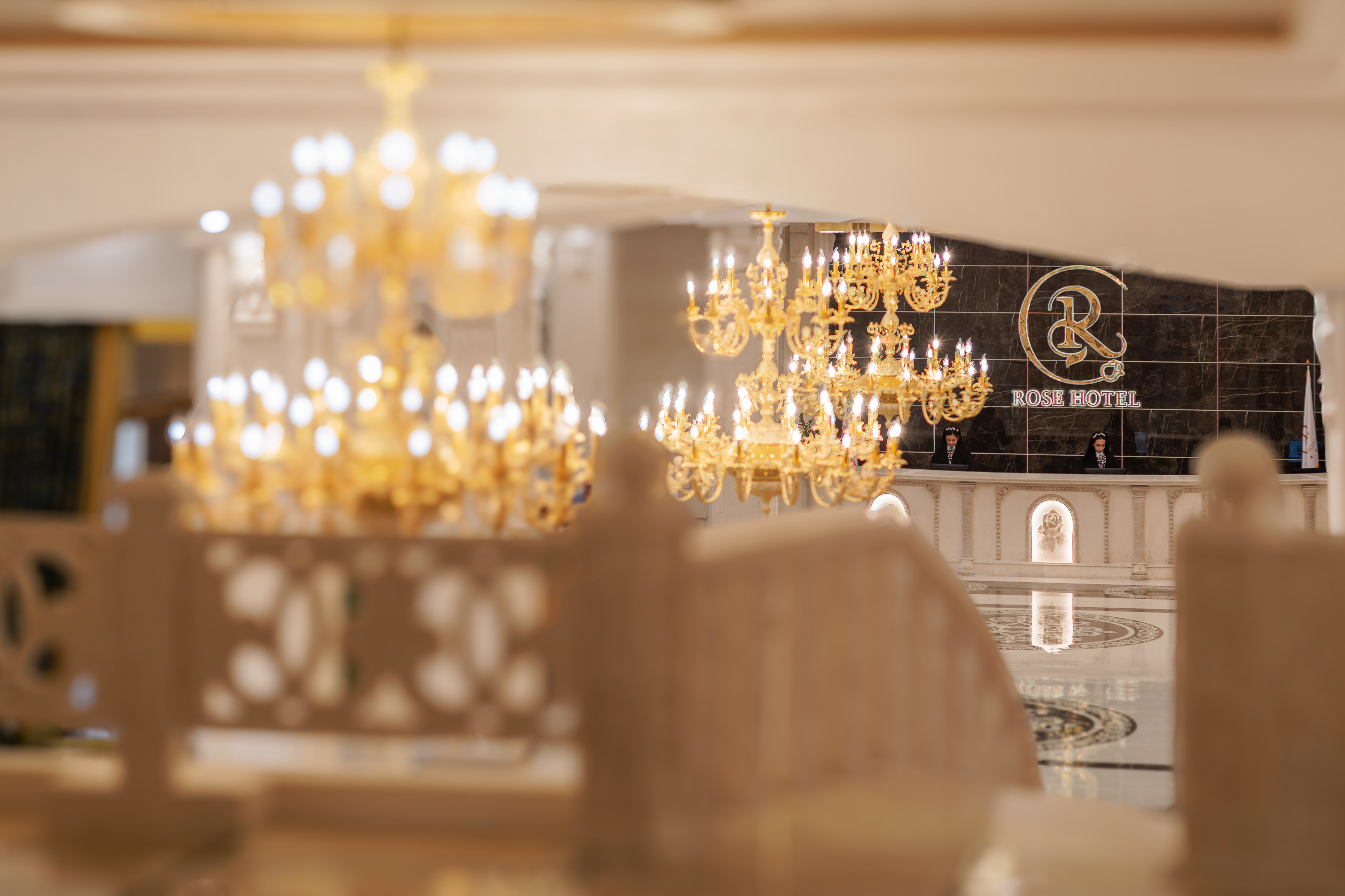 Rose Grand Hotel — grand lobby with crystal chandeliers